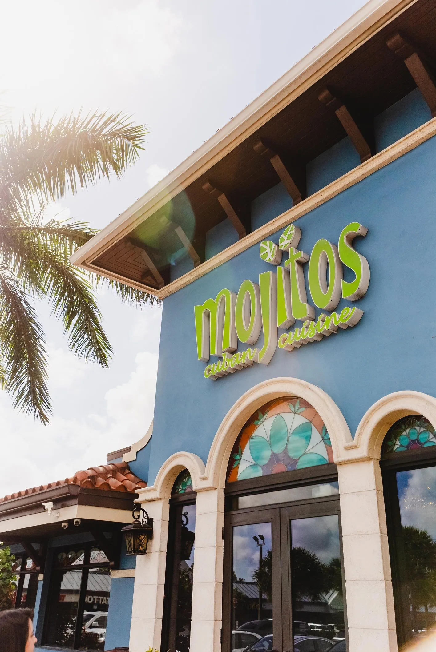 Mojitos Calle 8 — the iconic blue building on Calle Ocho at night